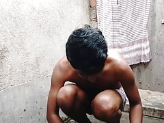 Indian gay bathing nude and washing his clothes, Indian boy showing his big cock in public place