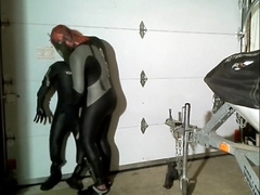 wetsuited spiderman grasps orca