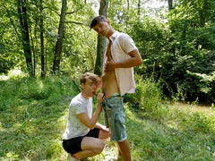 Outdoor fun in the park between a tanned boy and his lovely boyfriend