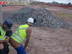 Public workers having bang-out on the construction website.