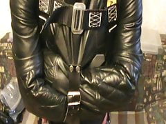 Straitjacketed slave is suspended