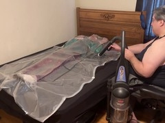 Christmas Day vacpacking in red PVC pants and a green satin shirt while bound in PVC aprons