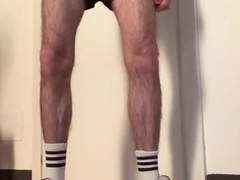 wooly man in sneakers and white socks faps off and showcases his gams