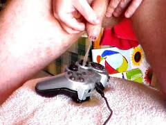 John is peeing all on a gamepad