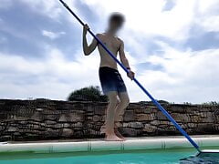 Pool boy jerks his huge uncut cock by the pool