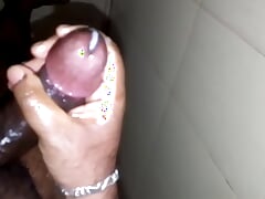 Guy jerk his oiled up black cock harder and shoot cum.