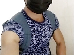 Young gay Latino in bathroom