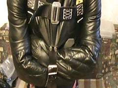 Straitjacketed slave is suspended