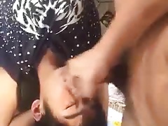 Asian having a dick put on his lips while on a bank outside