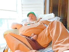 Bib overalls on farmer grandpa with wide feet has hands-free across the room