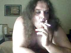 Smoking and rinding on a dildo