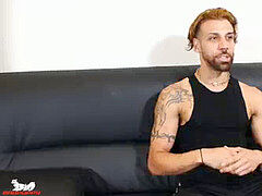 FX stretches his legs, lies back & strokes his pecker