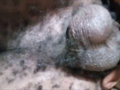 Horny black amateur Kenyan massaging his dick on the sofa