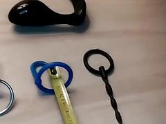 Freak with a fetish uses a device on his prick