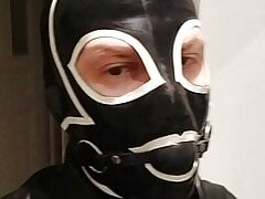 Latex mask gag slave