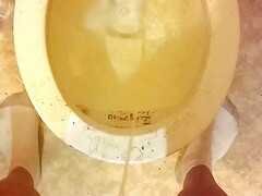 Peeing and cock play in bathroom.