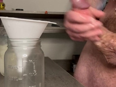 Dangled Spunk God Pumps a Jar Total of His Ball butter