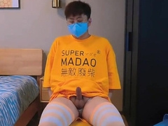 Guy in yellow t-t-shirt and stocking drains and pops at home