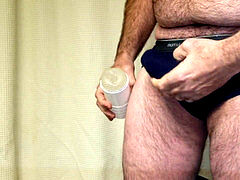 observe throughl Fleshlight type masturbator up close