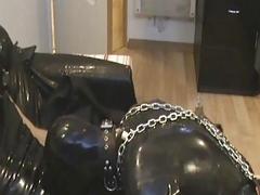 Submissive guy in chains giving head