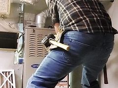 HVAC dad working on customer's heater