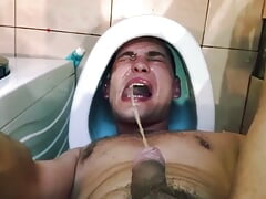 cute guy PISSES on own face while head in toilet  Uses his mouth as a toilet TOILET SLAVE DRINK