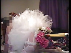 crossdresser riding toy on bed