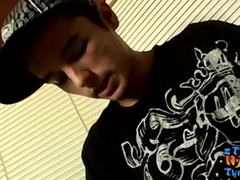 Young heterosexual thug gazes at you while he milks his pink cigar