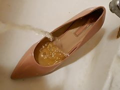 Piss in pink stiletto high heel