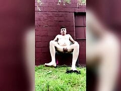 NUDIST POSING OUTSIDE