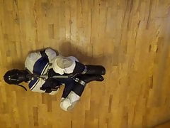Bound in leather suit & caged