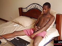 Slim Ebony teases asshole while wanking his lubed dong