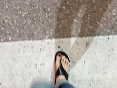 I tempt you with my sexy feet while walking on the street