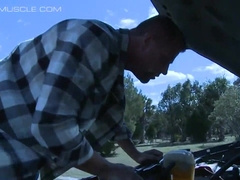 Beefy cowboy gets trussed up to the front of a van