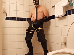 Rubbergloved wanking in the hotel shower wearing waders